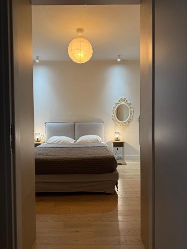 a bedroom with a bed and a mirror at 2 Bedroom 2 Bath Modern Apartment in Athens