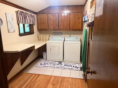a small kitchen with a washer and dryer at The Downer House in Chattanooga