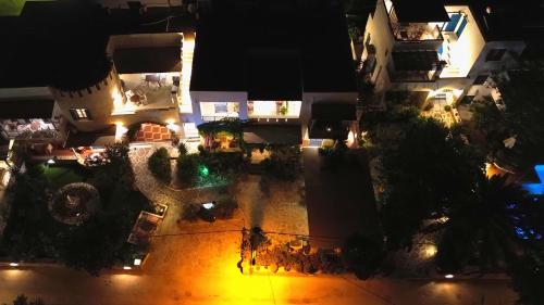 an overhead view of a courtyard at night at Ioanna Apartments in Agios Prokopios