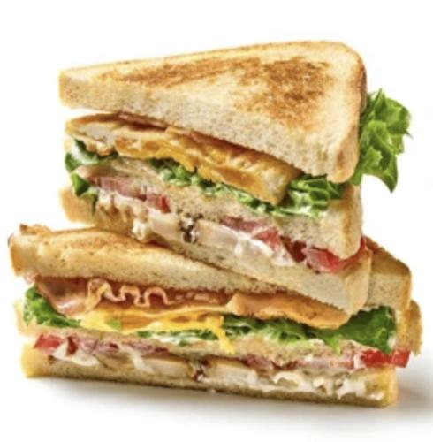 a sandwich cut in half on a white background at Medore Hotel & Next to the Beach in Canakkale