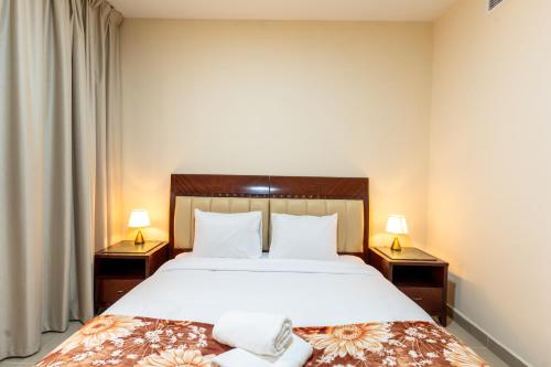 Postel nebo postele na pokoji v ubytování Royal Tulip - One Bedroom Apartment