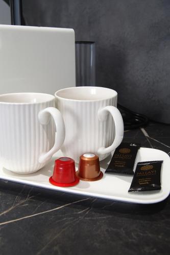 Příslušenství pro přípravu čaje a kávy v ubytování Apartment GREY Comfort