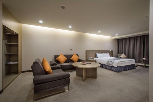 Ένα ή περισσότερα κρεβάτια σε δωμάτιο στο Zhong Ke Hotel
