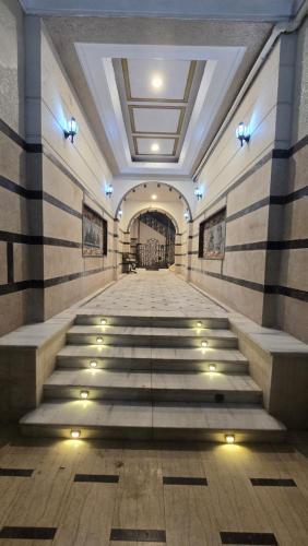 an empty hallway with stairs in a building at Cairo Orginals Hostel in Cairo