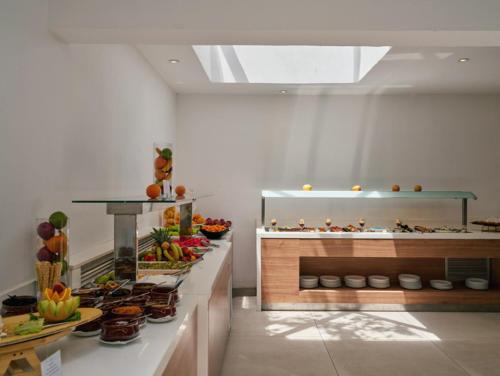 a kitchen with a bunch of food on display at Blue Sea Island in Kolimbia