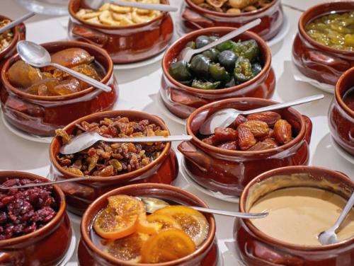 a bunch of bowls of food on a table at Blue Sea Island in Kolimbia