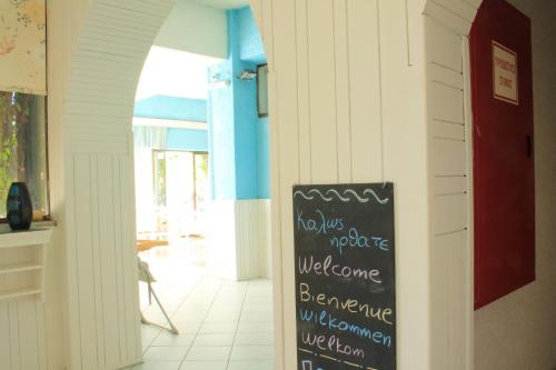 a chalkboard sign in a hallway of a house at Esperides Hotel in Myrtos