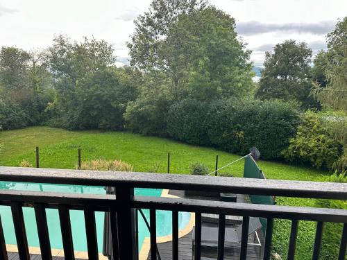 a balcony with a view of a yard at Havre de paix in Chainaz-les-Frasses