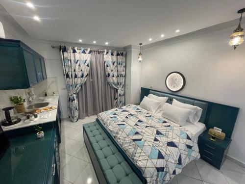 a bedroom with a bed and a sink in it at Danda moon Pyramids Hotel in Cairo