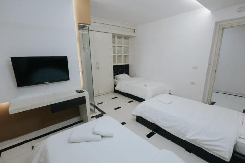 Katil atau katil-katil dalam bilik di Hotel Kristal