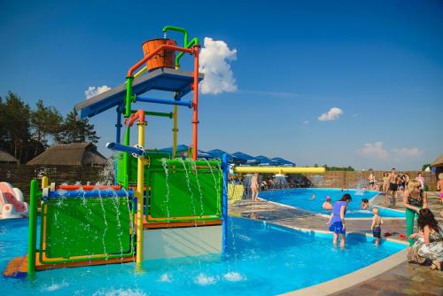 a group of people playing in a water park at Ресторан Отель Гуляй Поле in Novomoskovsʼk