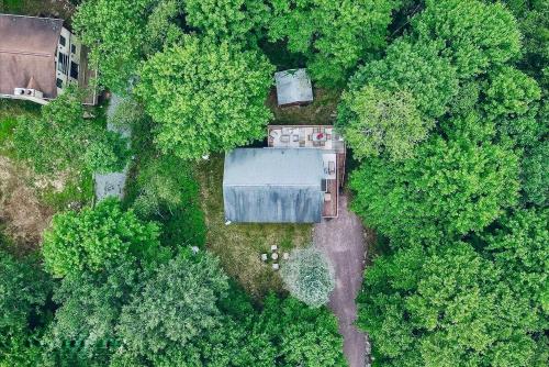 an overhead view of a house in the middle of a forest at Poconos Getaway with Hot Tub-Close to Attractions, Perfect for Family &Friends! in Blakeslee
