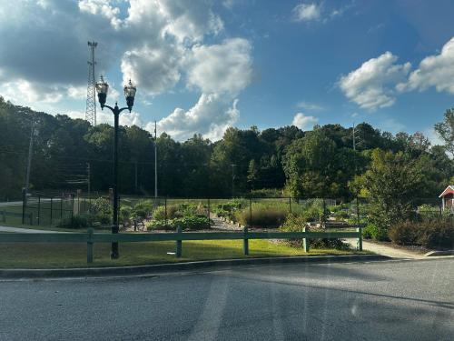 an empty street with a street light and a park at Luxury Cozy Glamping Cabin Retreat Natural Hide Out in Sugar Hill