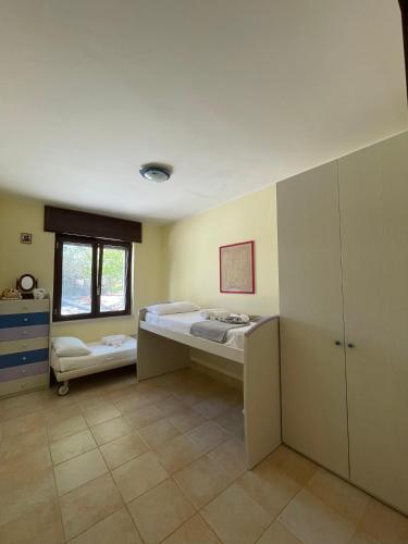 Ένα ή περισσότερα κρεβάτια σε δωμάτιο στο Villa Colline Fiorite