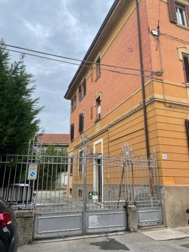 a building with a gate in front of it at La Casetta in Bologna