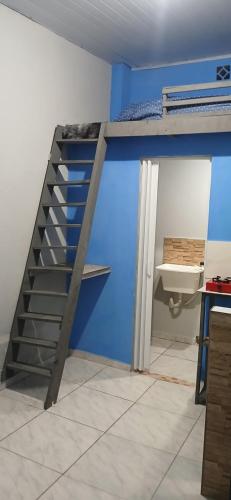 Lliteres en una habitació de Kitnet estilo loft