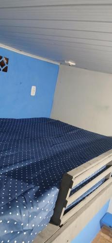 A bed or beds in a room at Kitnet estilo loft