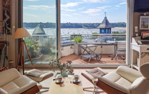 a living room with a view of a large window at Gorgeous Apartment In Dinard With House Sea View in Dinard