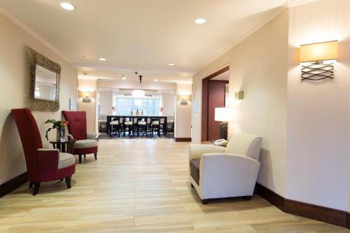 a hospital lobby with chairs and a dining room at Holiday Inn Express & Suites Walterboro by IHG in Walterboro