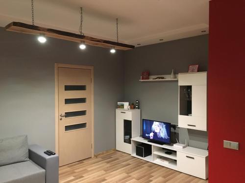 Телевизор и/или развлекательный центр в Center Apartment Ventspils