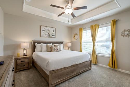 a bedroom with a bed and a ceiling fan at 2029 Pinnacle Walk Drive Norcross in Norcross