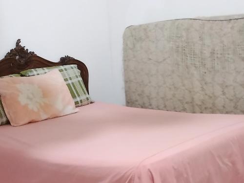 Ένα ή περισσότερα κρεβάτια σε δωμάτιο στο Casa de temporada