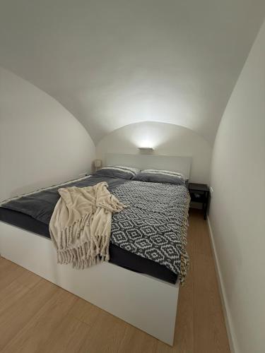 a bedroom with a large bed in an attic at Luxury apartment in the historic city center in Košice