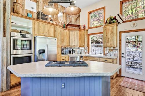 a large kitchen with wooden cabinets and a counter top at Aspen Springs Sundance, Mountain Cabins Utah, 5 BR, 4 BA, Pool Table in Sundance
