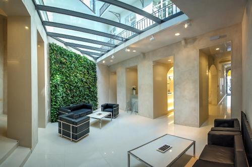 a living room with a large green wall at Bishop's House in Prague