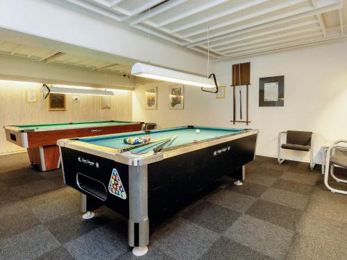 a billiard room with a pool table in it at Faaborg Holiday Centre in Fåborg