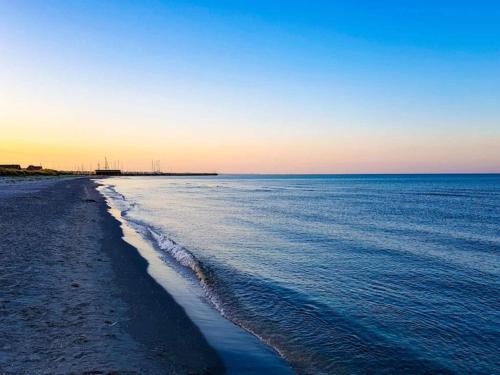 a view of the beach with the ocean at 10 person holiday home in Ålbæk-By Traum in Ålbæk