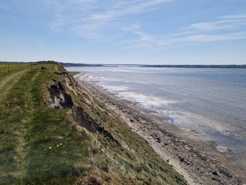 a view of the shoreline of a body of water at 6 person holiday home in Skals-By Traum in Skals