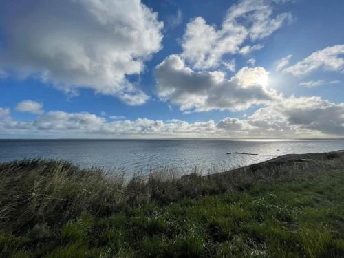 a view of the ocean from the shore of a beach at 10 person holiday home in Roslev-By Traum in Roslev