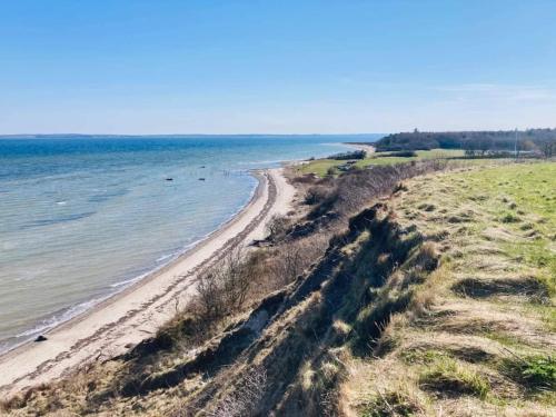an aerial view of a beach with the ocean at 10 person holiday home in Roslev-By Traum in Roslev