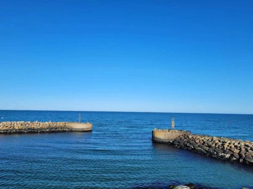 two barriers in the middle of a body of water at Luxury Retreat in albaek - By Traum Ferienwohnungen in Ålbæk
