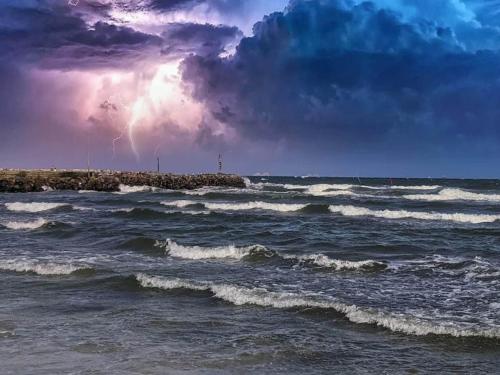 a group of waves in the ocean with a storm at Luxury Retreat in albaek - By Traum Ferienwohnungen in Ålbæk