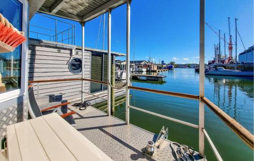 a boat is docked at a dock in the water at Nice Ship In Göteborg With Sauna in Gothenburg