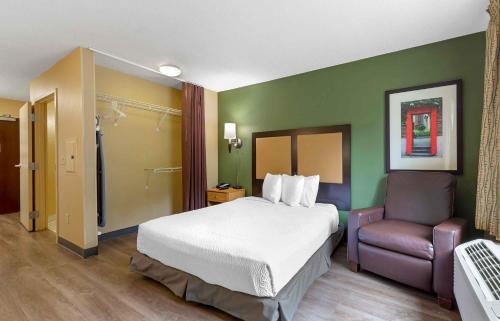 a hotel room with a bed and a chair at Extended Stay America Suites - Columbia - Laurel - Ft Meade in Jessup
