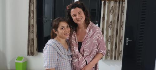 two women are standing next to each other at Sony homestay in Komodo Labuan Bajo Airport