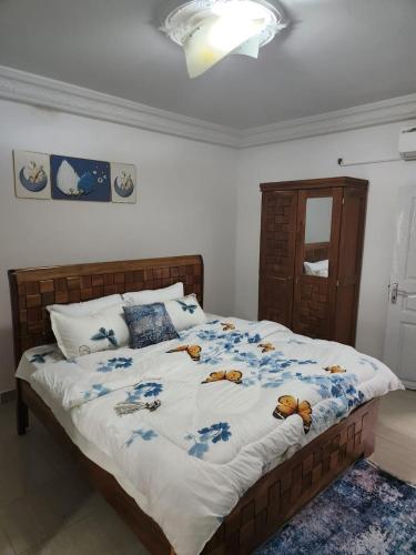 a bedroom with a bed with stuffed animals on it at Ramo in Dakar