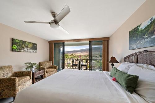 a bedroom with a large bed and a balcony at Lahaina Shores 306 · LS 306 Dream Maui Studio by the Beach Pool in Wainee