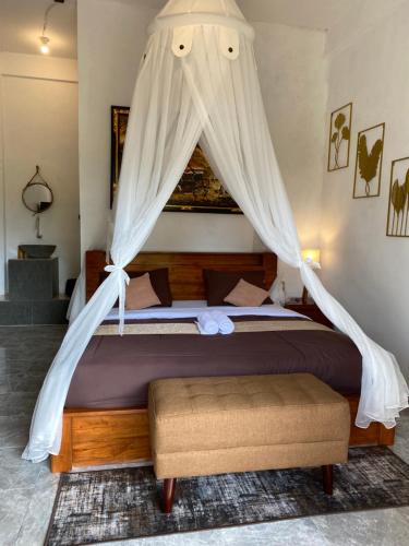 Ένα ή περισσότερα κρεβάτια σε δωμάτιο στο Munduk Twin Homestay