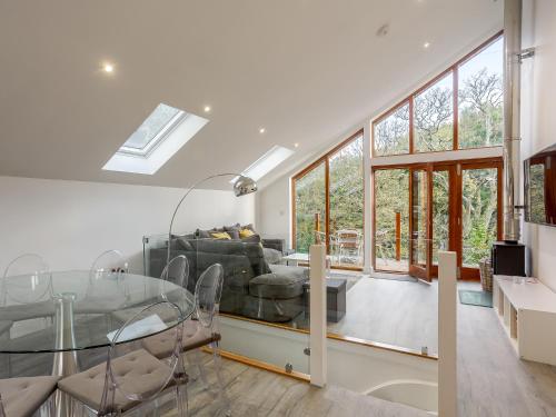 a living room with a glass table and a couch at Waterside Lodge One - Uk33351 in Southowram
