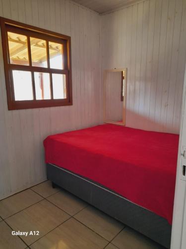 Katil atau katil-katil dalam bilik di Casa 150 metros do mar