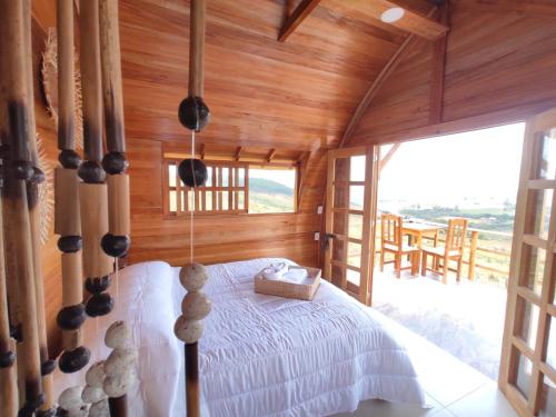 Ένα ή περισσότερα κρεβάτια σε δωμάτιο στο GLAMPING Cabanas Andes Village Barichara