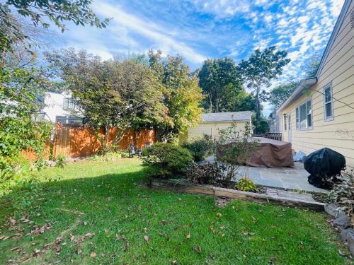 a backyard of a house with a yard with a yard at Private Estate, walk to Princeton downtown, 3 Bedrooms, 2 Bath, with Free Parking in Princeton