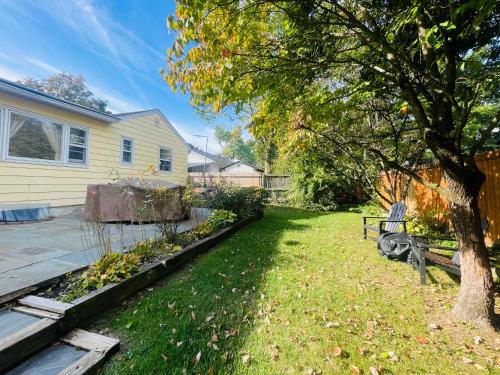 a yard with a tree and a house at Private Estate, walk to Princeton downtown, 3 Bedrooms, 2 Bath, with Free Parking in Princeton