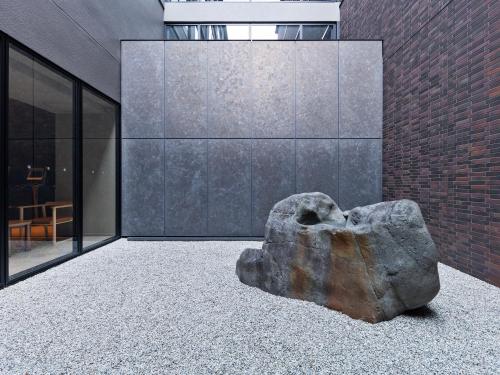 a large rock sitting on the floor of a building at Mitsui Garden Hotel Kyoto Sanjo PREMIER in Kyoto