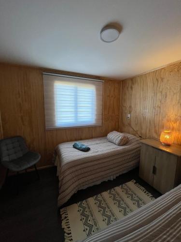 Postel nebo postele na pokoji v ubytování Cabaña Acogedora Puerto Natales
