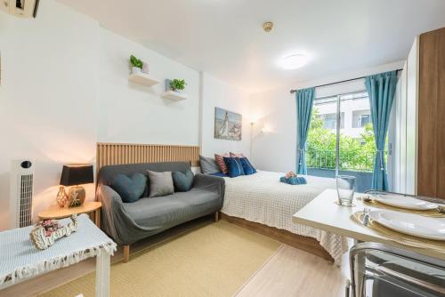 En eller flere senge i et værelse på Elio Sukhumvit 64 BTS Punnawithi